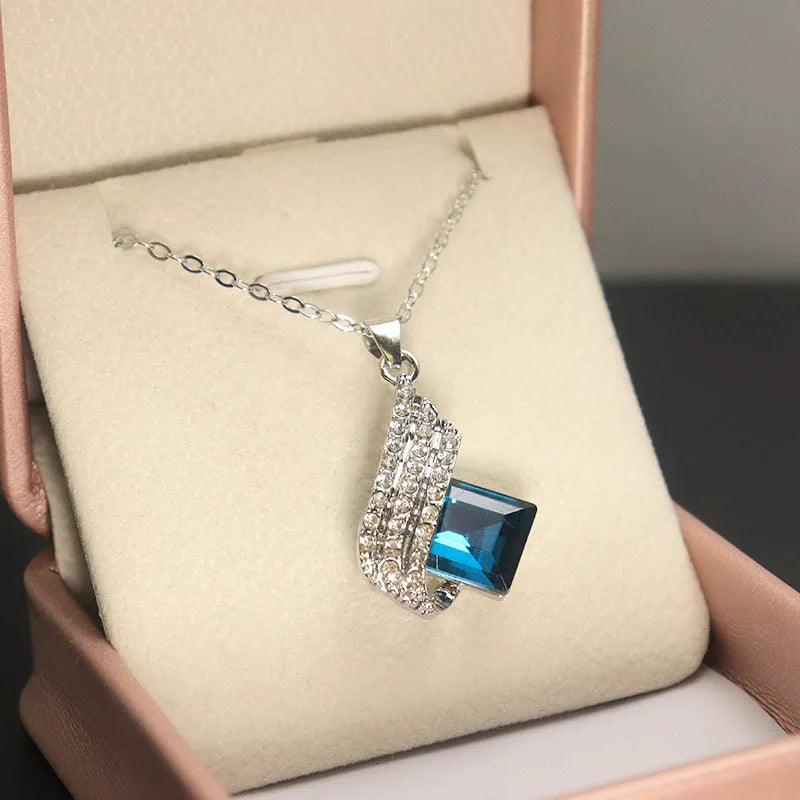Women's electroplated alloy necklace and earrings set with glass detail and cross chain style