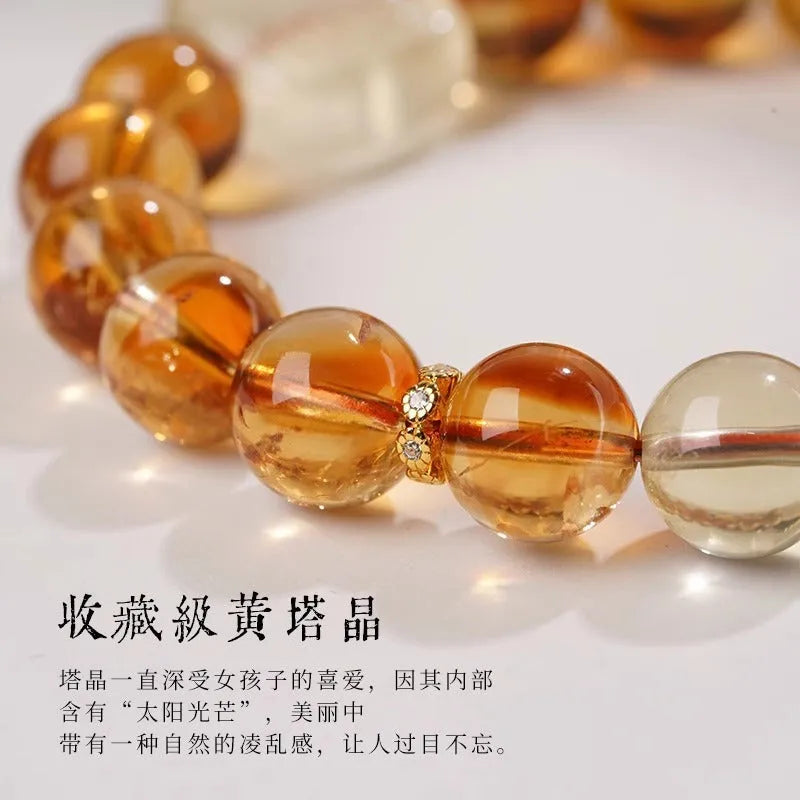 Women's ethnic style carved citrine crystal bracelet with geometric 10mm beads on a white background