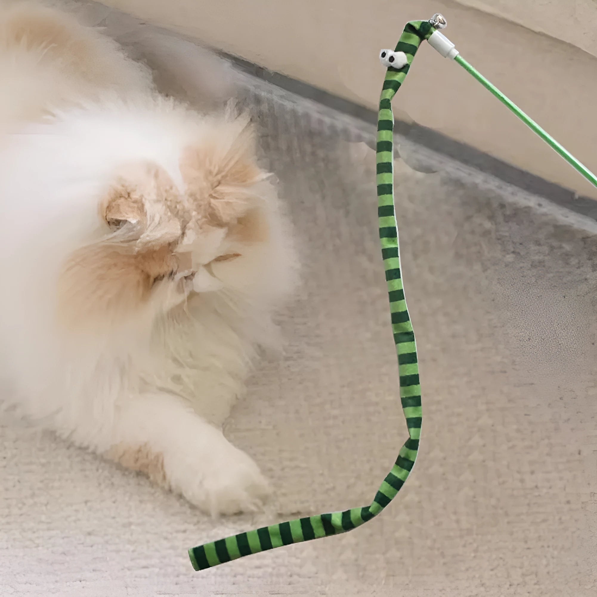 Cat wand toy with polycarbonate pole and long plush strip in rainbow colours with bell attachment