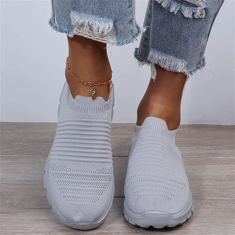 Women's knit sock shoes in beige with breathable upper, round toe, and low rubber sole