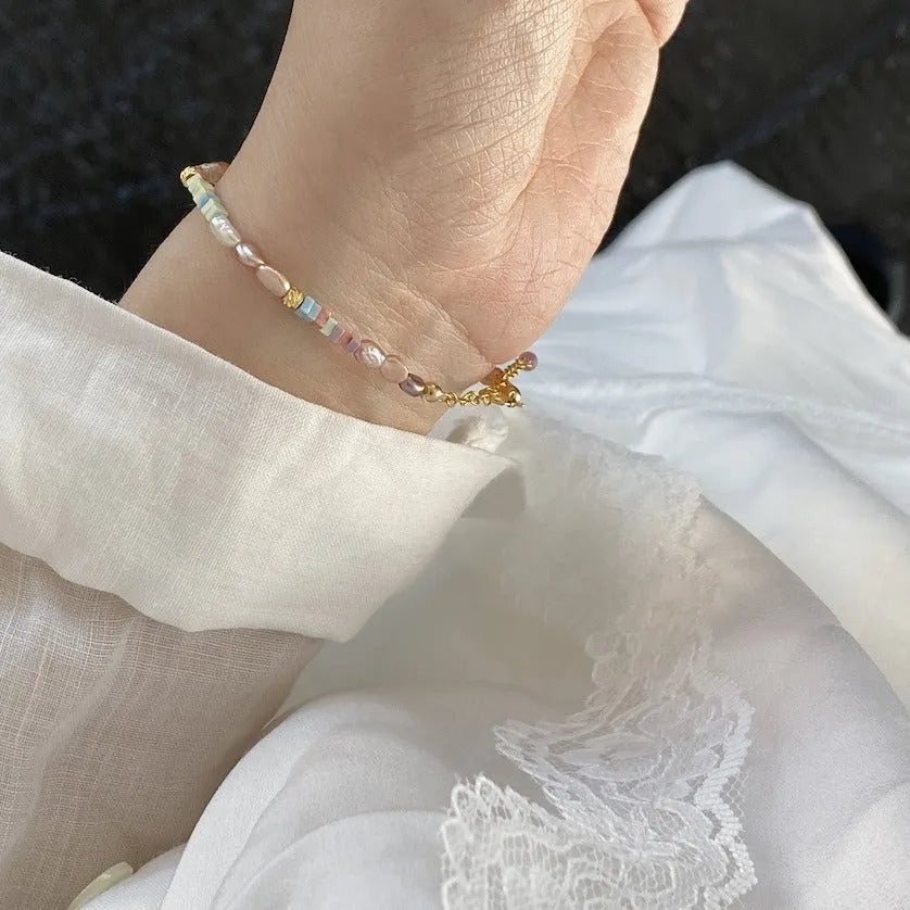 Natural pearl bracelet and necklace set with 14K gilded purple finish in irregular U-shaped design