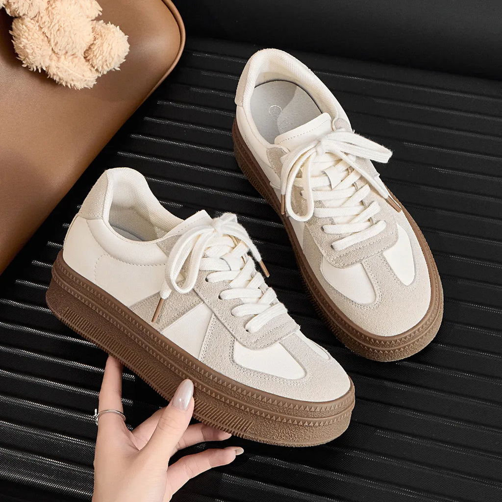 Retro round toe casual board shoes with cross shoulder straps, shown in milky white colour.