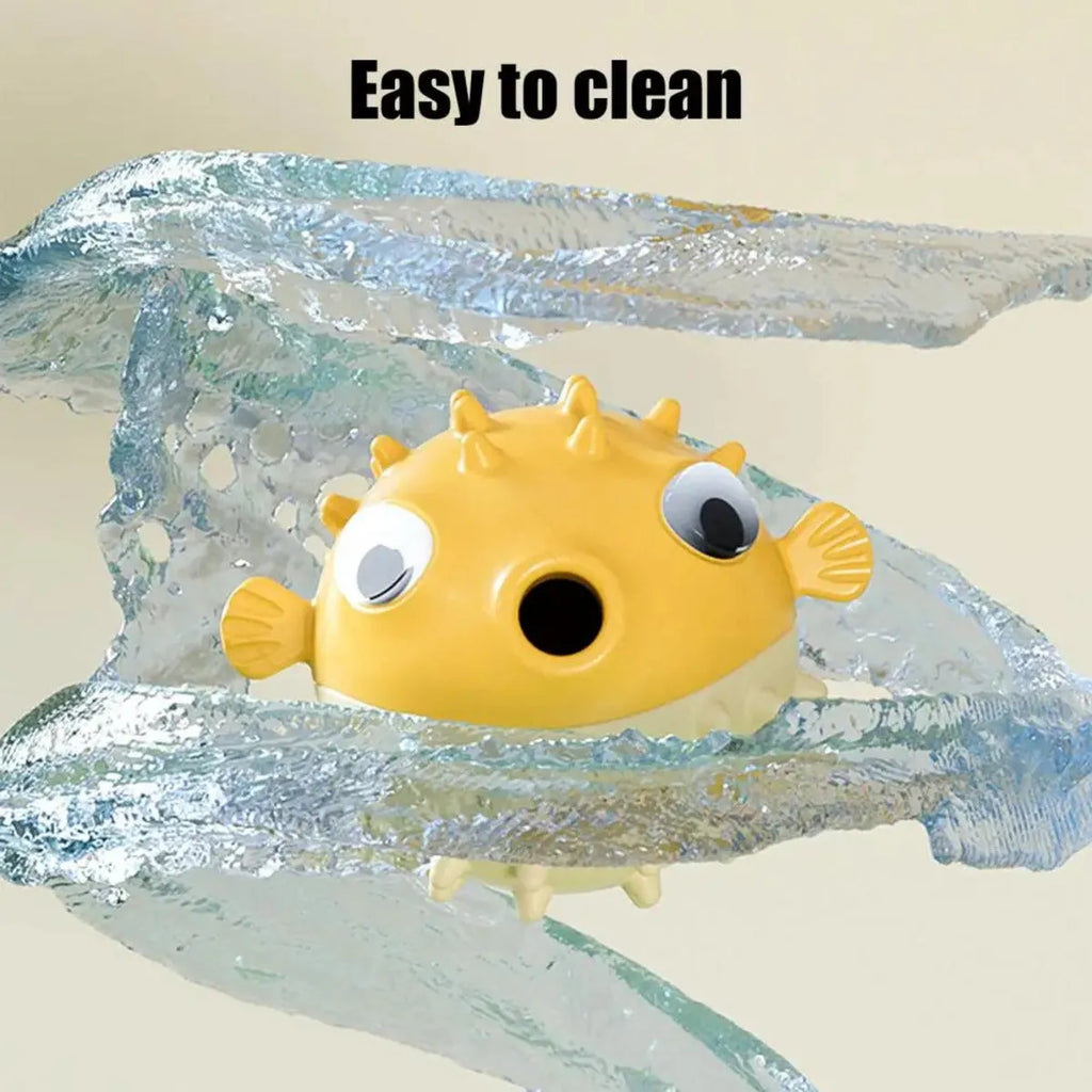 Yellow fish-shaped vinyl dog chew toy with textured surface and squeaker inside.