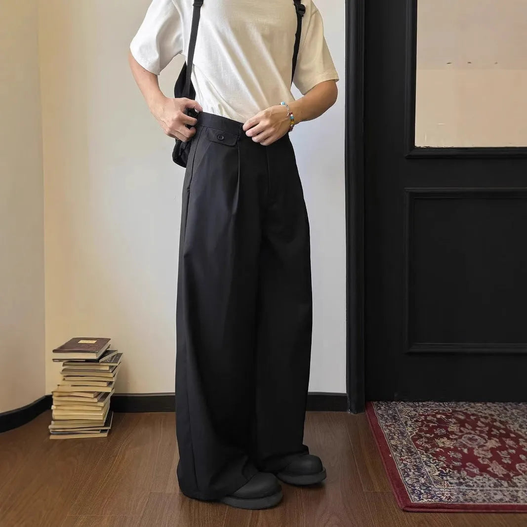 Men's brown straight-leg loose wide-leg casual suit trousers laid flat.