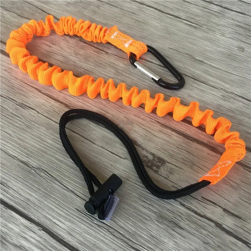 Orange fishing rod safety rope with 90cm length shown next to fishing reel