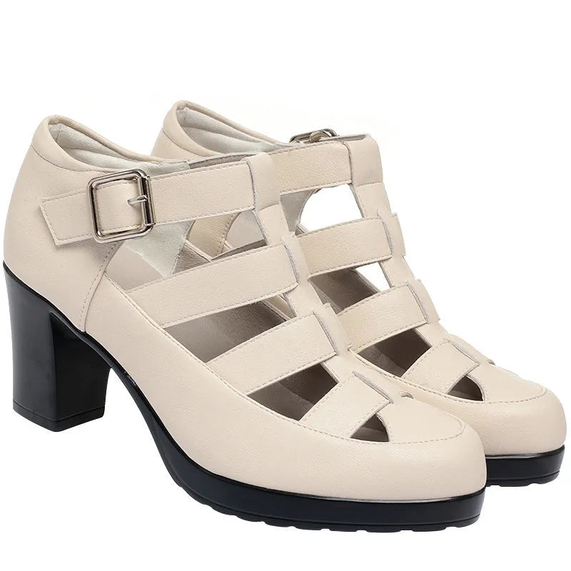 Women's beige closed toe sandals with woven upper, ankle strap, buckle, and back zipper on a chunky heel.