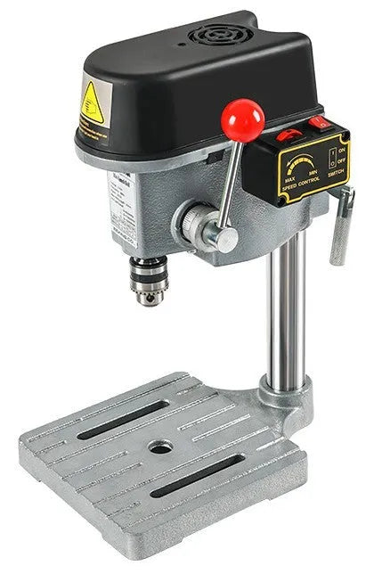 Bench drill and milling machine with cross bench pliers on workbench