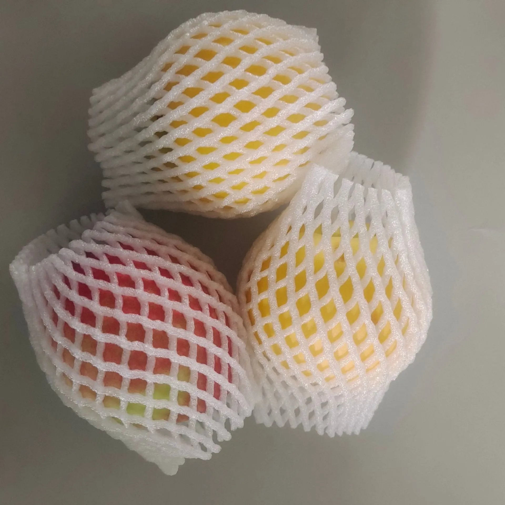 White foam fruit net protective cover for produce cushioning and shockproof packaging