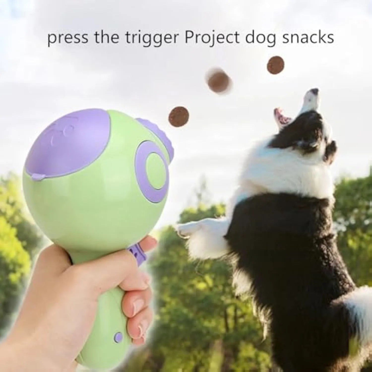 Green, orange, and pink plastic dog treat launcher toy for interactive feeding and training
