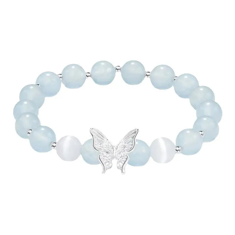 Cat eye crystal bracelet for women, bow shape, pink crystal option, on white background