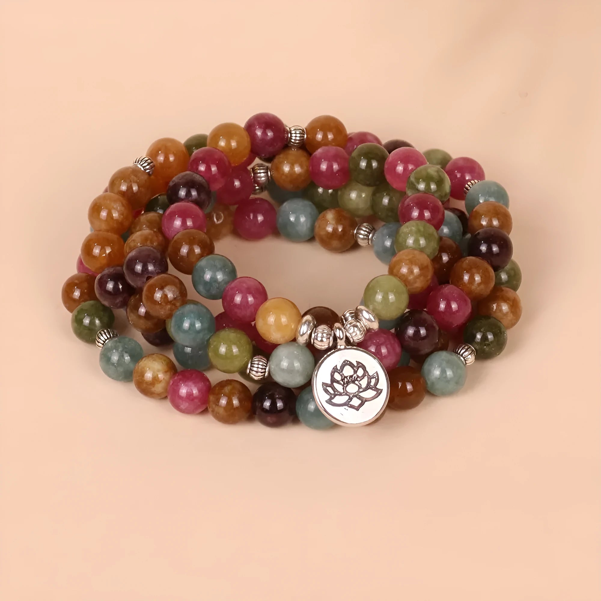 Tourmaline coloured 108-bead alloy bracelet with multi-layer lotus hanging design on adjustable string.