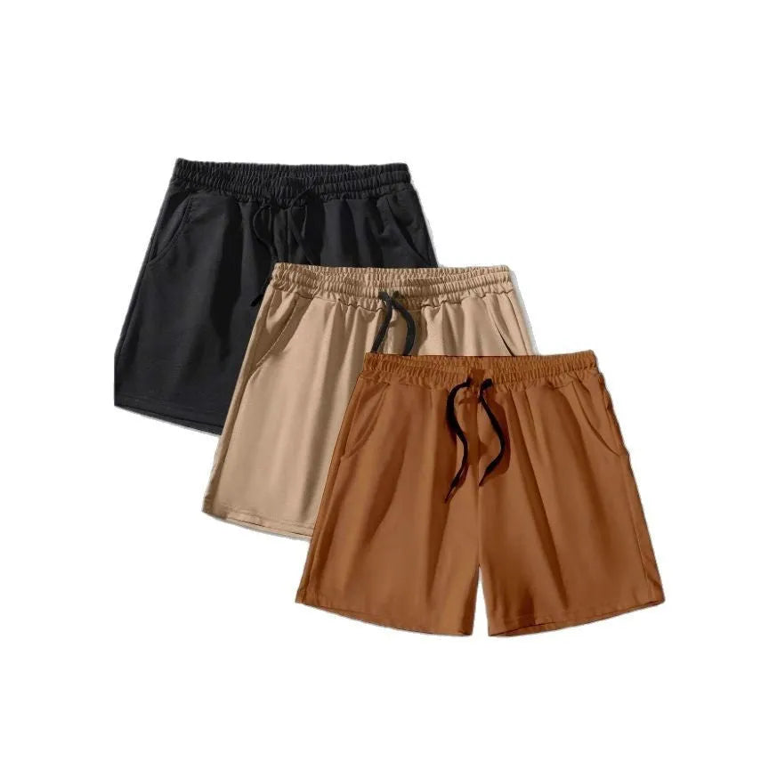 Pack of three men's casual drawstring shorts in black, khaki, and light brown colours laid flat.