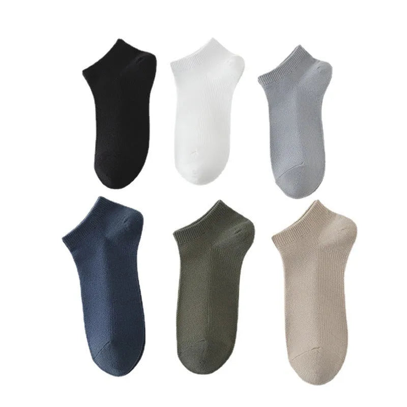 Solid colour low-cut polyester boat socks for men displayed in multiple colour options.