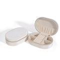 Oval shaped velvet jewellery storage box with flannel interior and inner hook, shown in lake blue.
