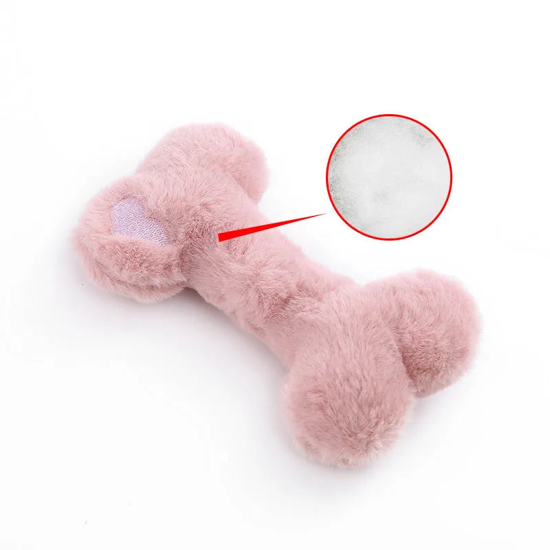 Blue pink and yellow plush bone dog toy with a textured grinding teeth surface.