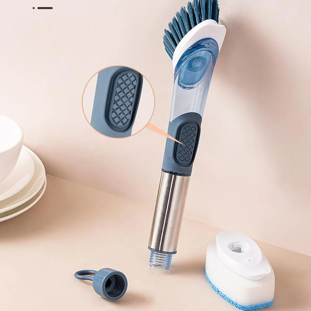 Multifunctional dish brush with soap dispenser, long handle, scouring block and sponge, in blue colour on a kitchen counter