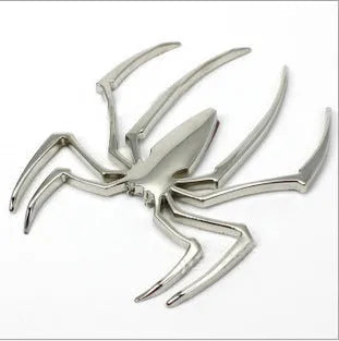 3D metal spider car bumper sticker in gold, silver, black, or red on a white background