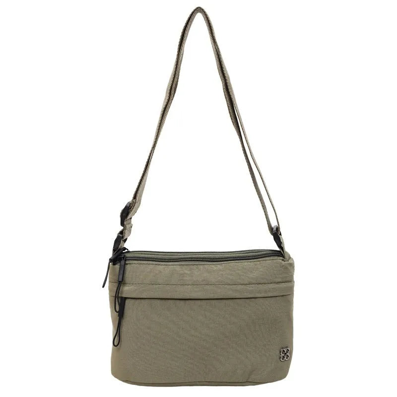 Lightweight cloth crossbody bag in black with horizontal square shape, sandwich pocket, and canvas lining
