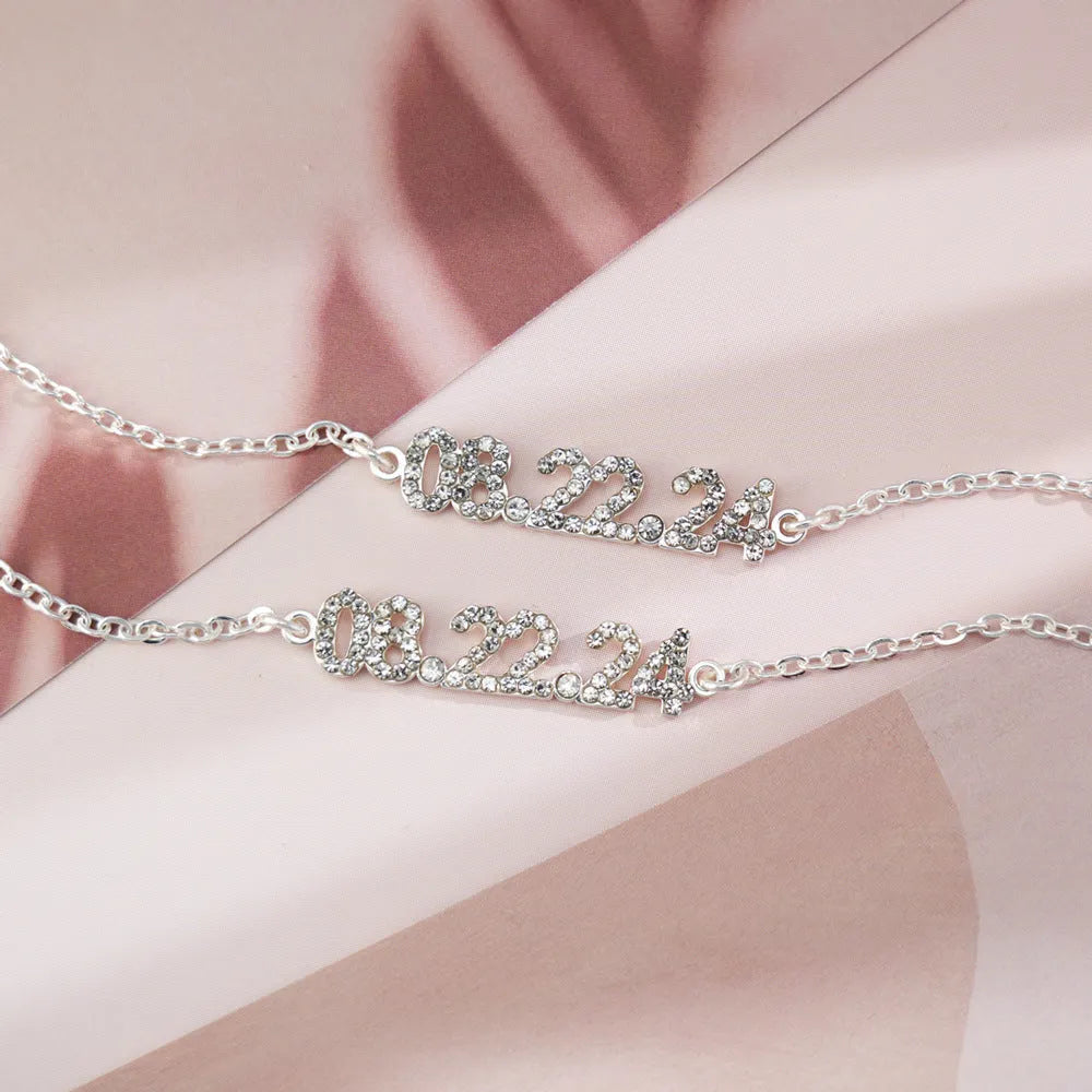 Stainless steel digital bracelet with diamond-studded numbers on display.