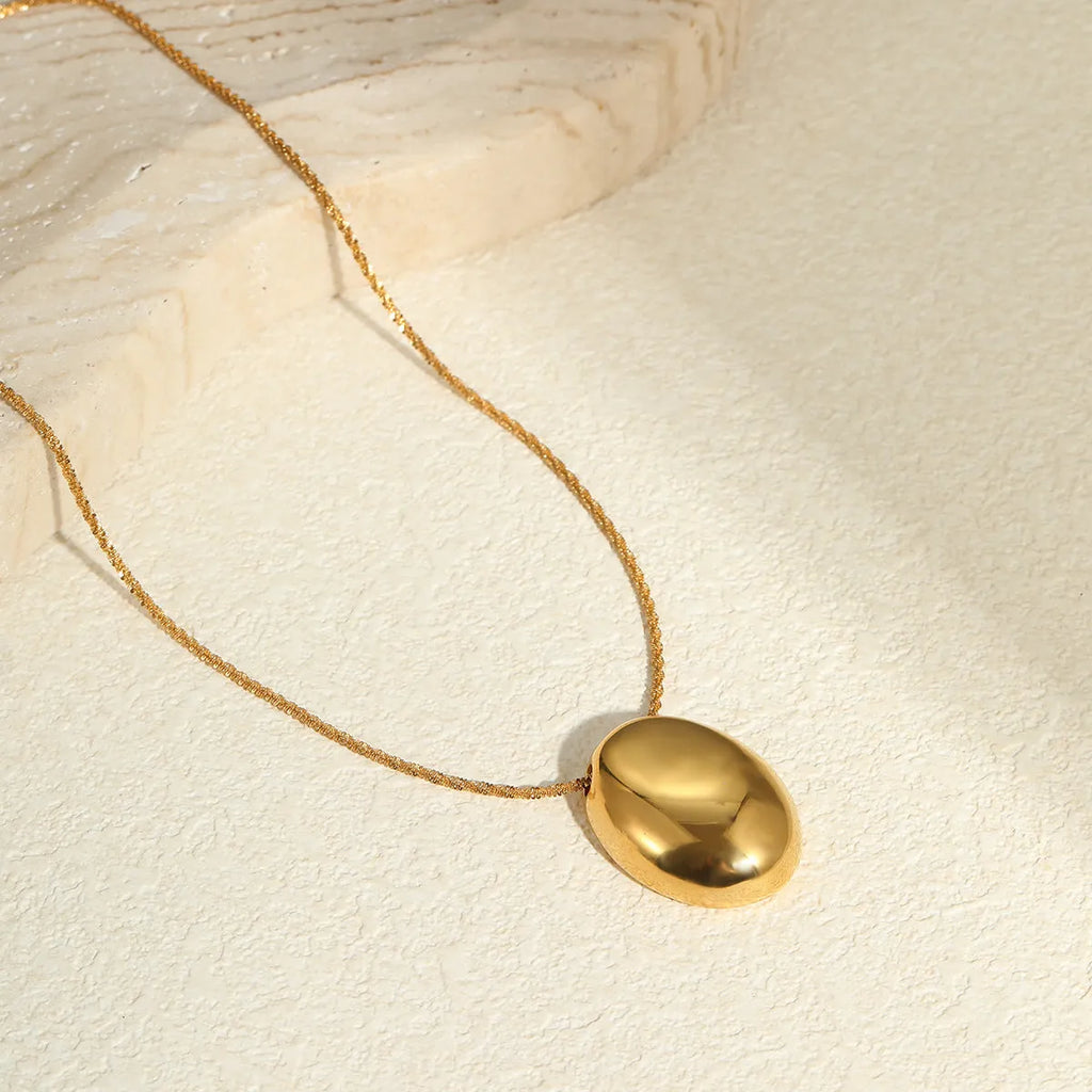 Gold geometric pendant necklace on adjustable chain with stainless steel construction