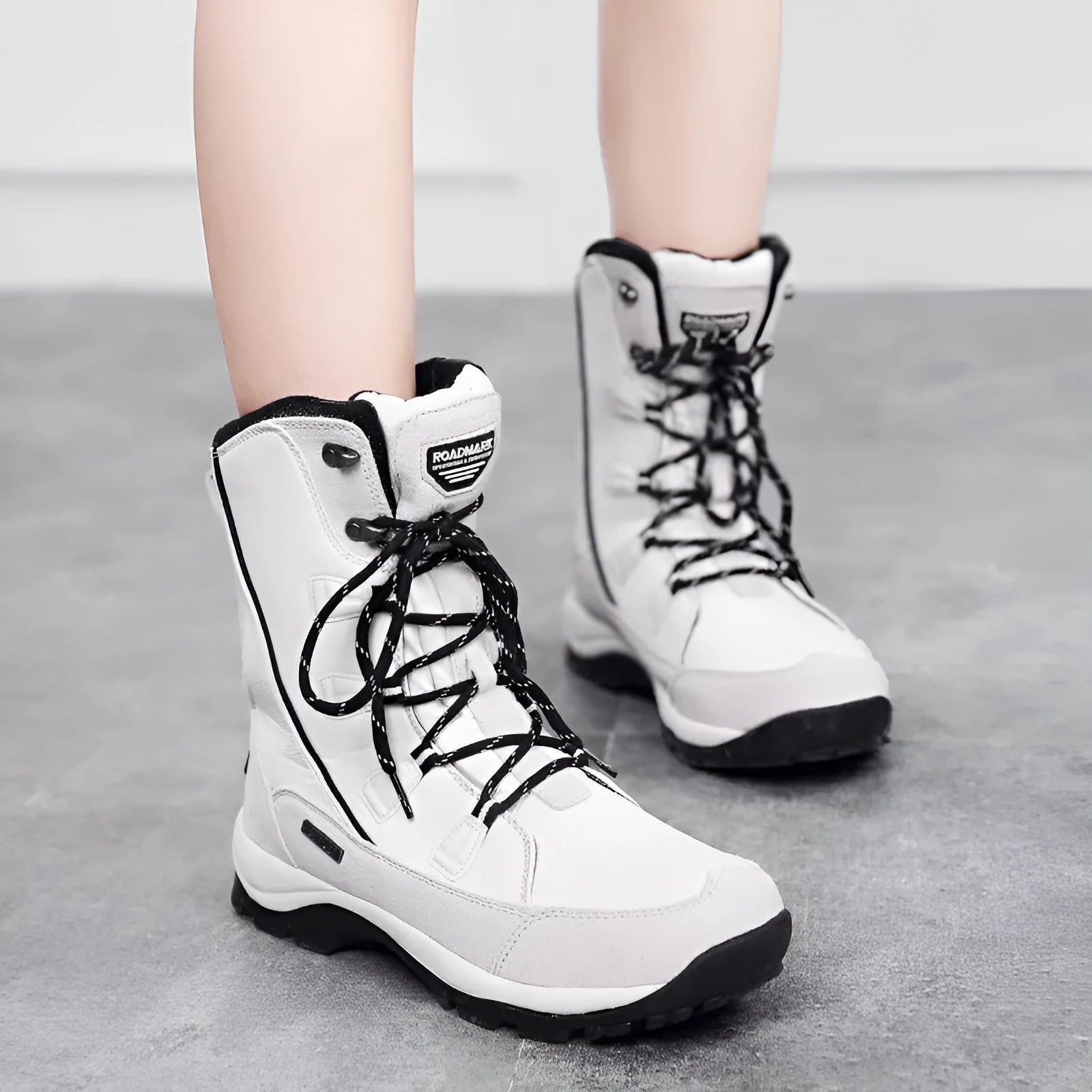 Women's genuine leather snow boots in mid-calf length with round toe and rubber sole