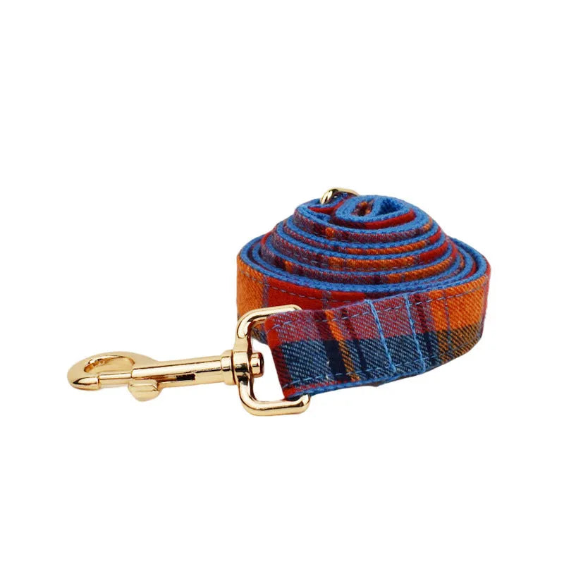 Blue velvet plaid dog collar set with cloth lead and hand holding rope on pet bandana
