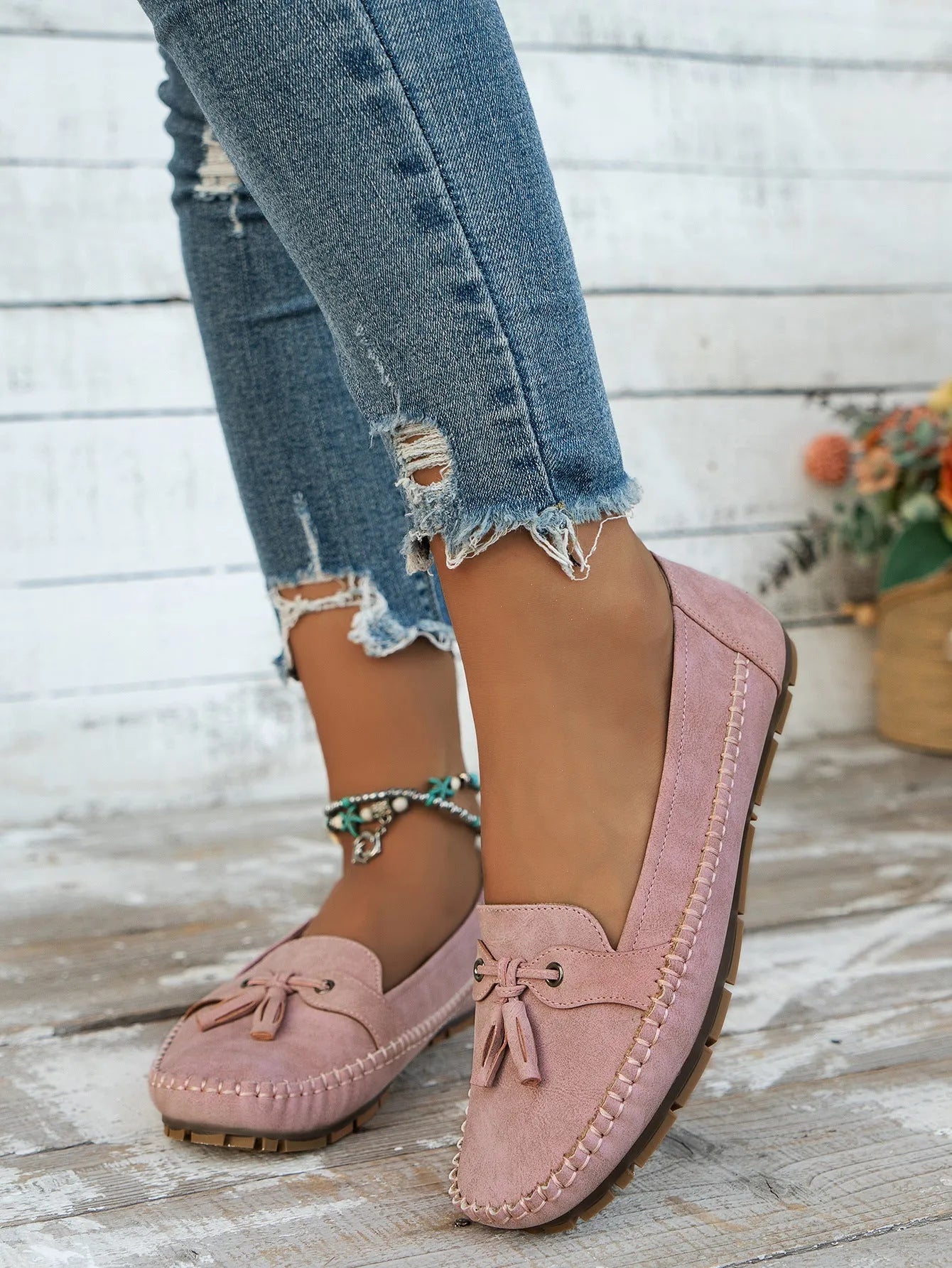 Women's suede bow flat shoes in pink with round toe and low flat heel