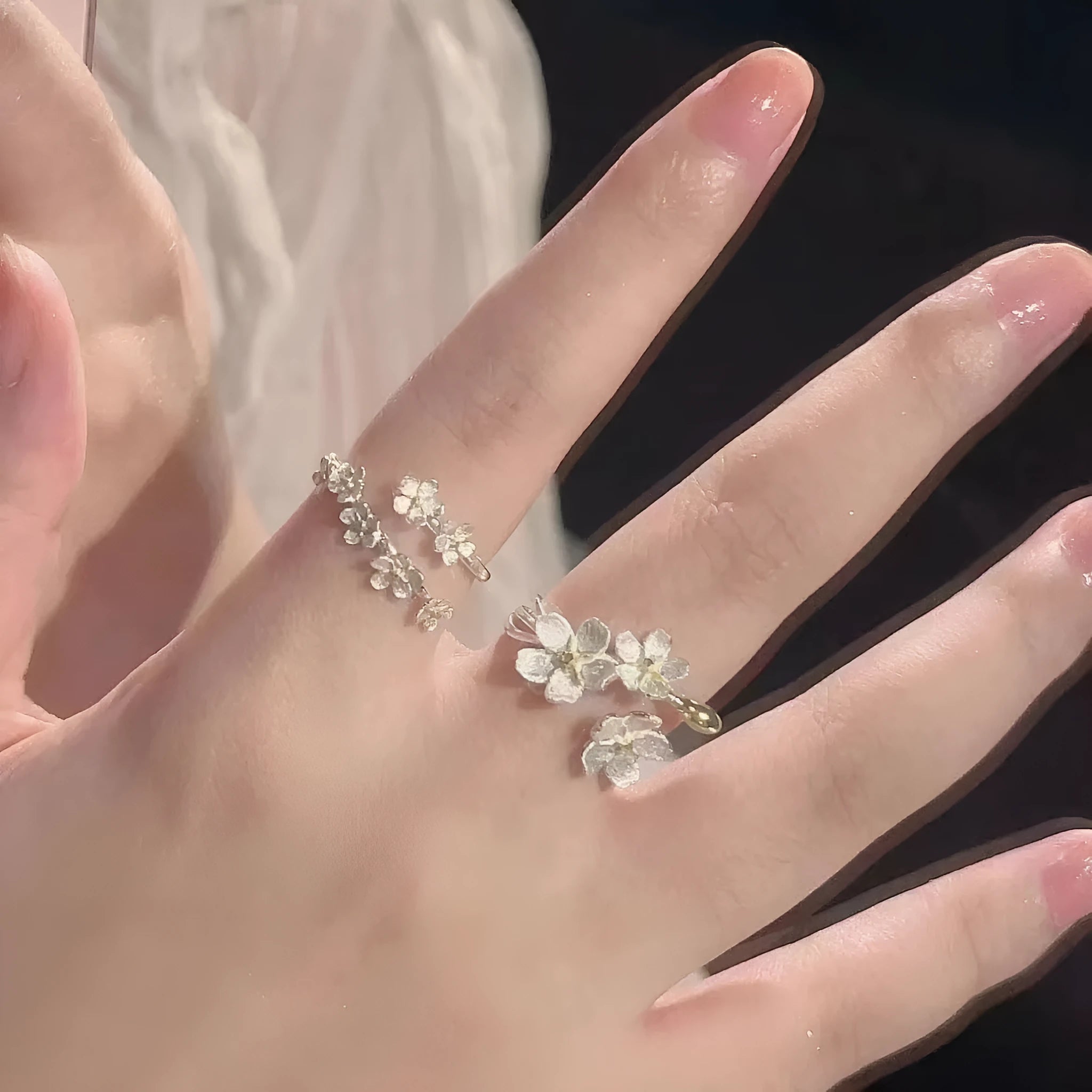 Three-dimensional jasmine and camellia flower ring with open-mouth design on zinc alloy.