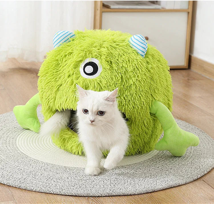 Round plush cat bed with non-slip base in three size options for indoor pets