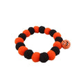 Orange Halloween pet collar for cats with pumpkin pattern and Trick or Treat text, showing plastic buckle.