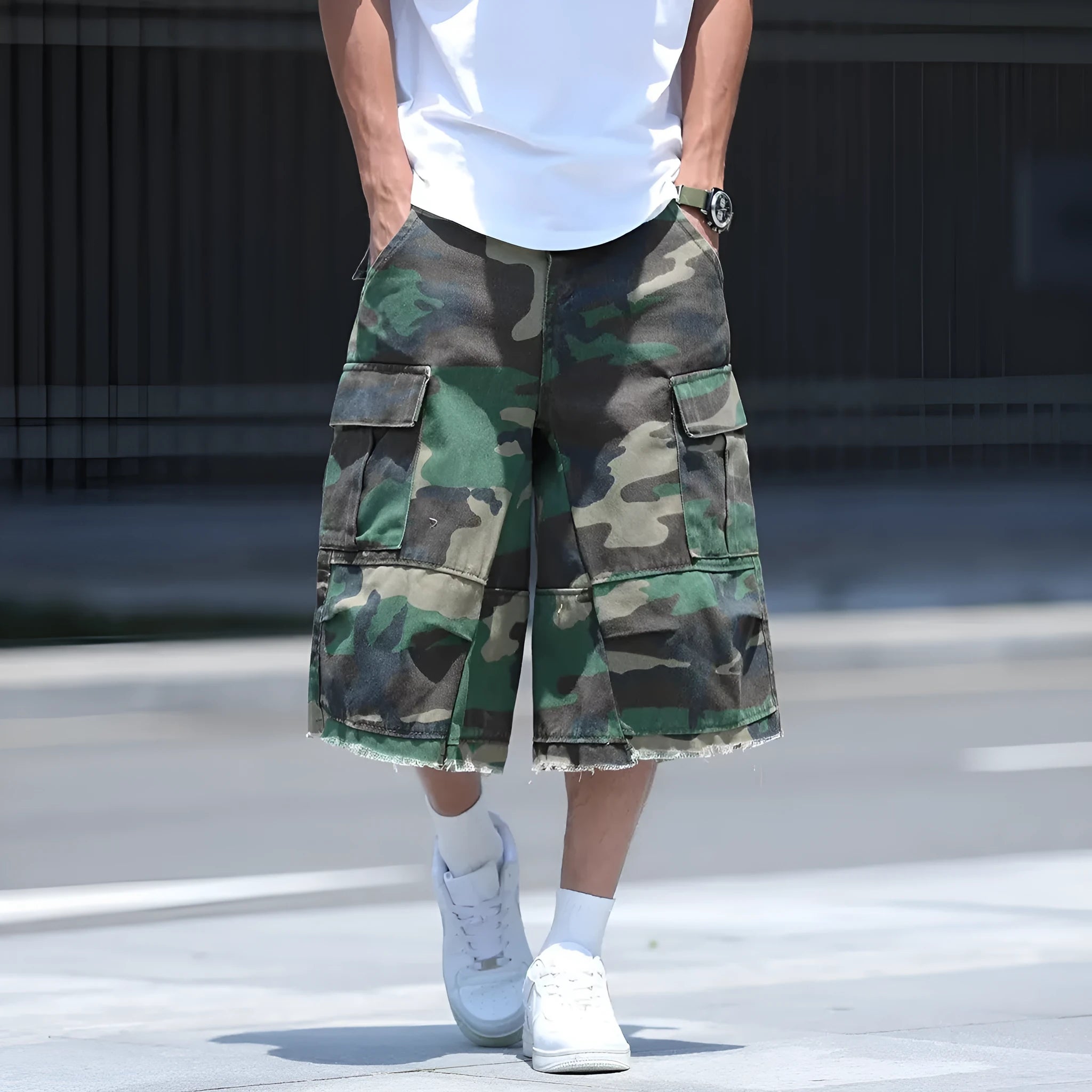 Man wearing loose-fit cropped camouflage shorts in retro American workwear style.