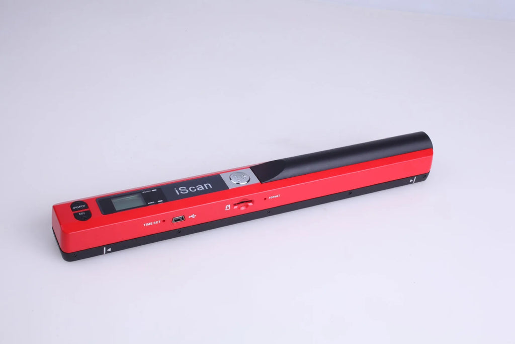 A handheld plastic scanner in silver, with a USB cable connected, on a desk next to documents.