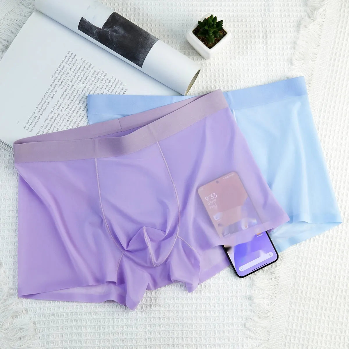 Ultra-thin ice silk seamless men's boxer briefs in various colours on a white background.