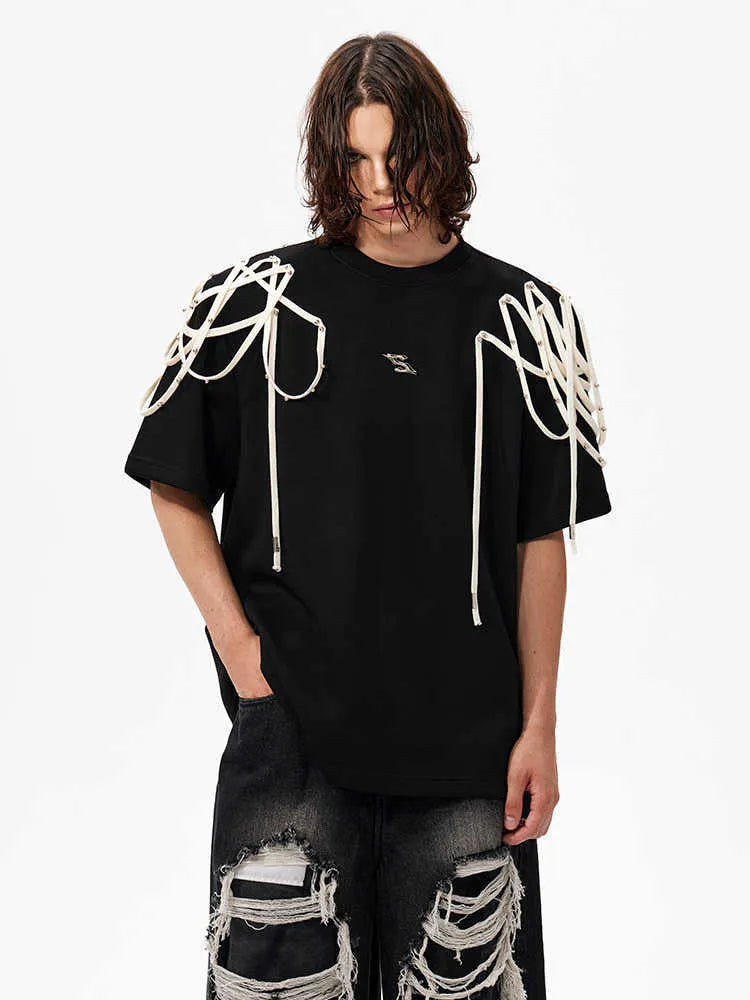 Black loose fit short-sleeve T-shirt with padded shoulders and decorative rivet ribbons.