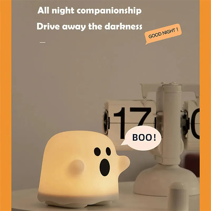 Silicone night light in Ah Ah style on a bedside table with soft glow