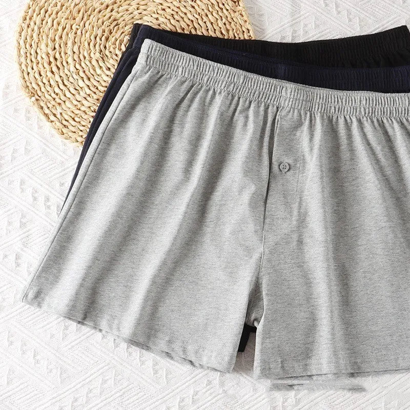 Men's light grey cotton boxer shorts with high waist and loose fitting design