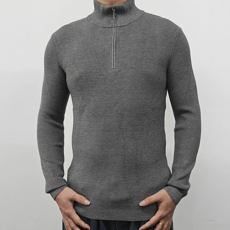Man wearing a grey half-turtleneck zip-front casual sweater
