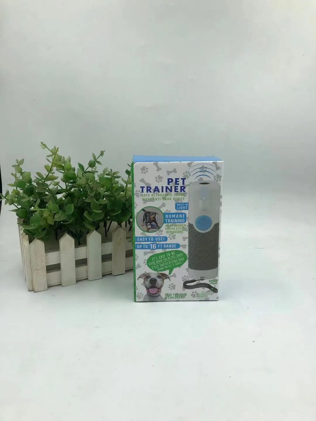 White handheld ultrasonic dog bark control trainer device with compact design