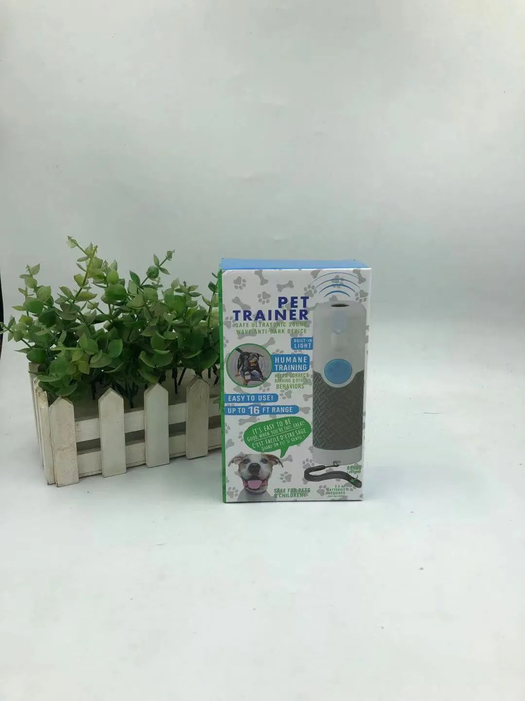 White handheld ultrasonic dog bark control trainer device with compact design