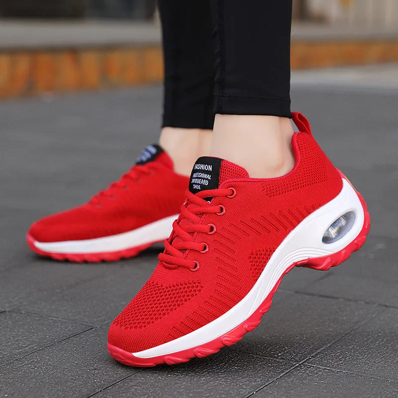 Women's black mesh sneakers with front lace-up design and round toe