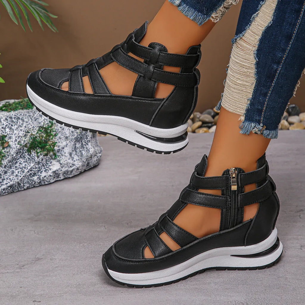 Women's black close-toed platform sandals with hollow-out design and Velcro strap.