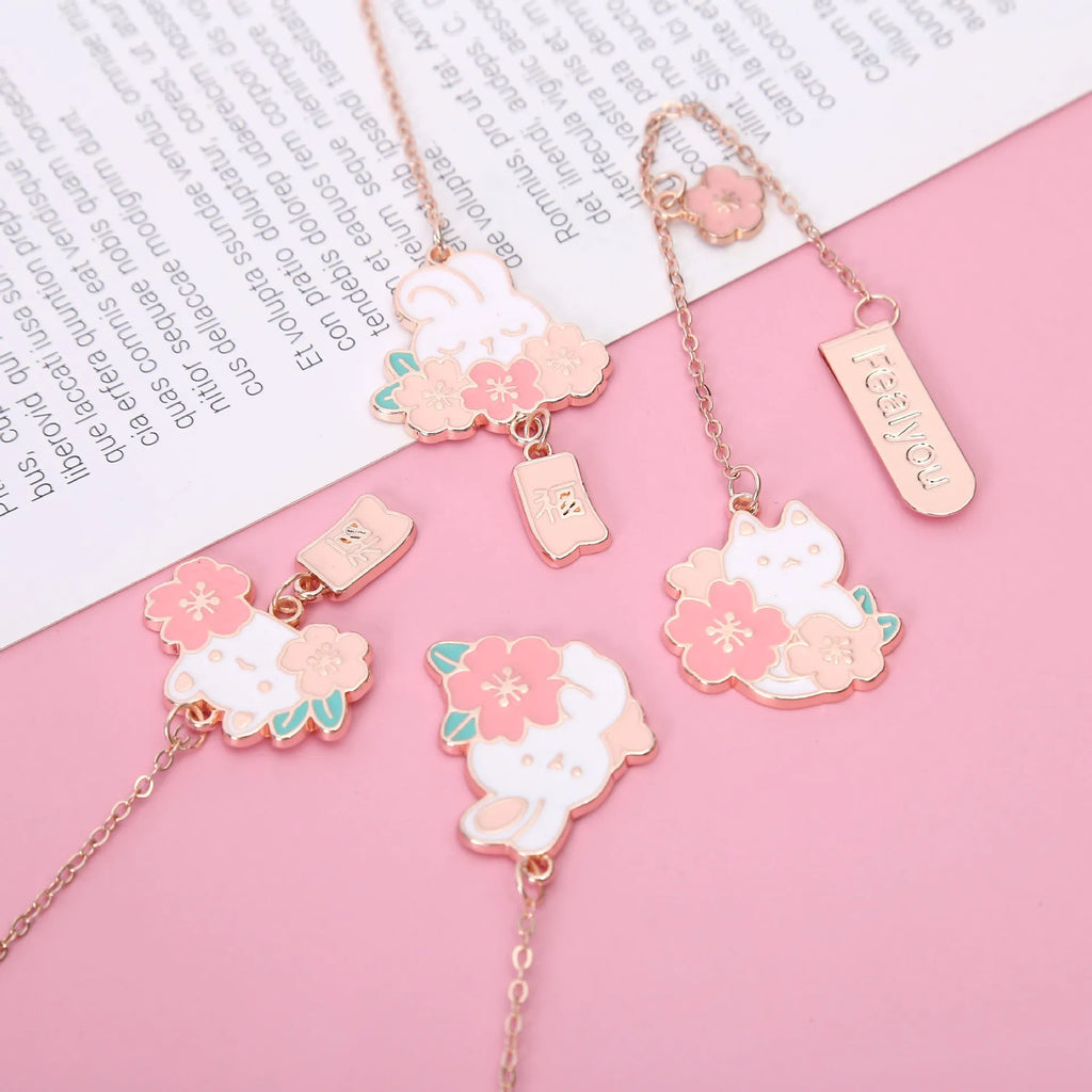 Creative cartoon metal pendant bookmark with cute cherry cat design in sakura style on white background