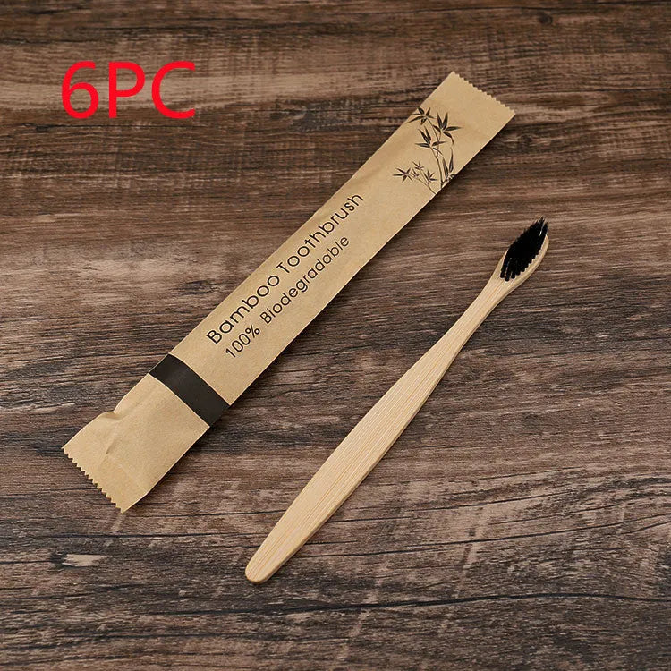 10 bamboo toothbrushes with soft charcoal bristles in assorted colours arranged fanned out