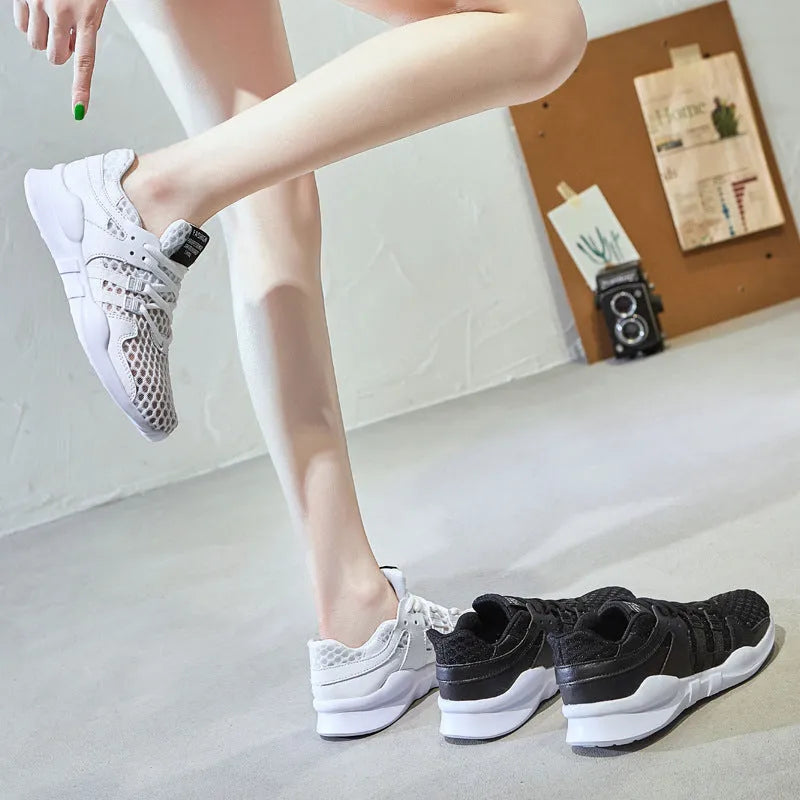 Low-top mesh sneakers in white with a hollow-out EVA sole design on a solid colour background.