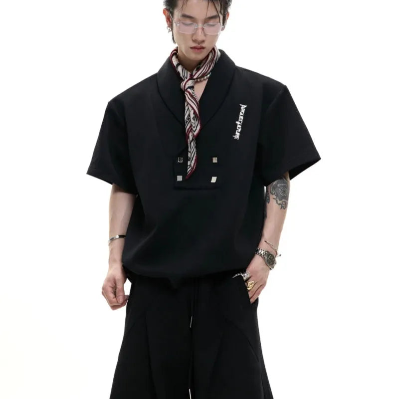 Men's dark grey V-neck padded shoulder short sleeve cotton jacket with metal details and matching trousers.