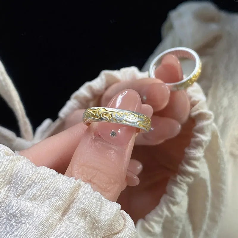 White copper open mouth ring with Xiangyun pattern and silver gold electroplated finish.