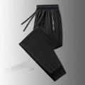 Men's thin ice silk polyester loose fit trousers in black legging style