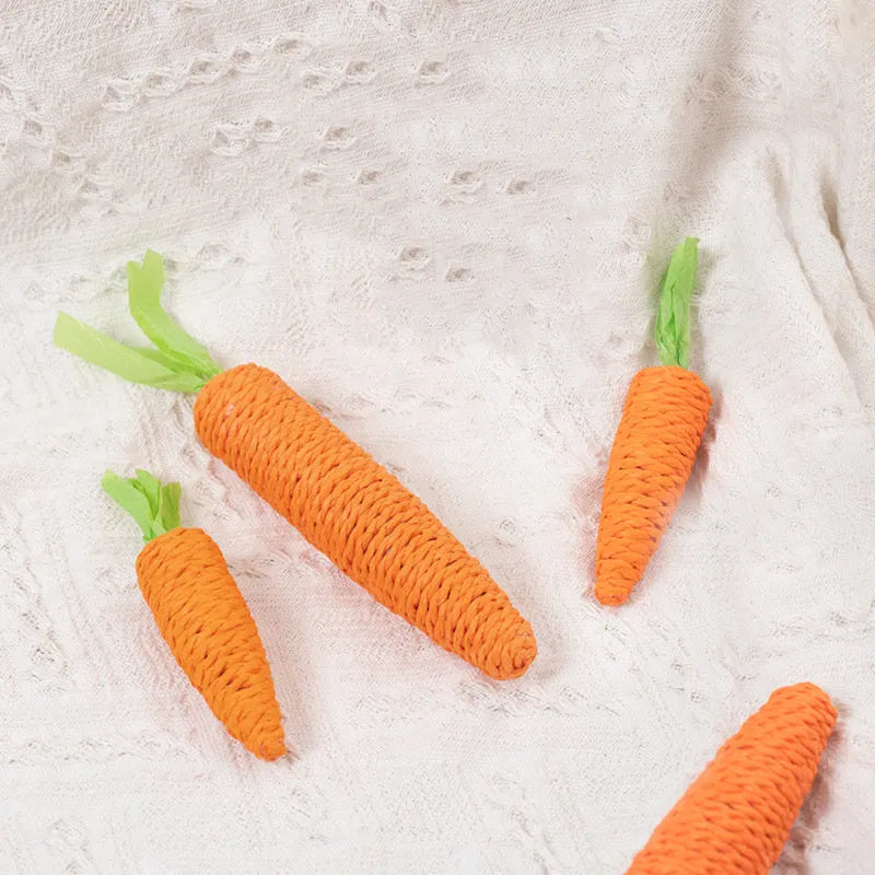 Assortment of cat toys including carrot shapes, paper balls, and grinding sticks in two size options