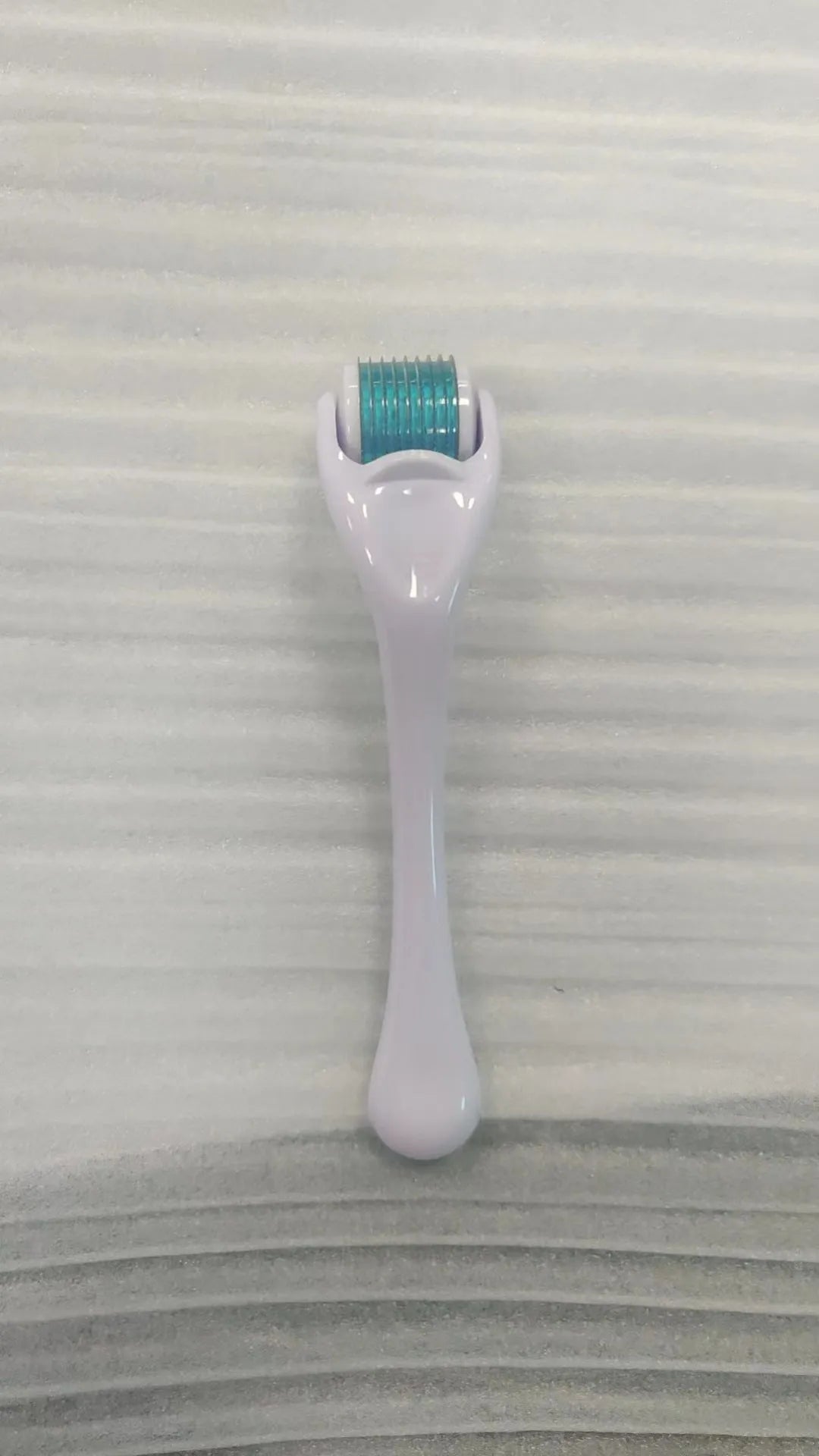 540 needle derma roller with black handle and coloured wheel, showing 0.25mm 0.3mm size options for micro-needling.