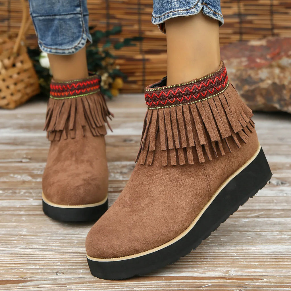 Women's suede wedge booties with side zipper, thick rubber sole, and tassel detail in black colour